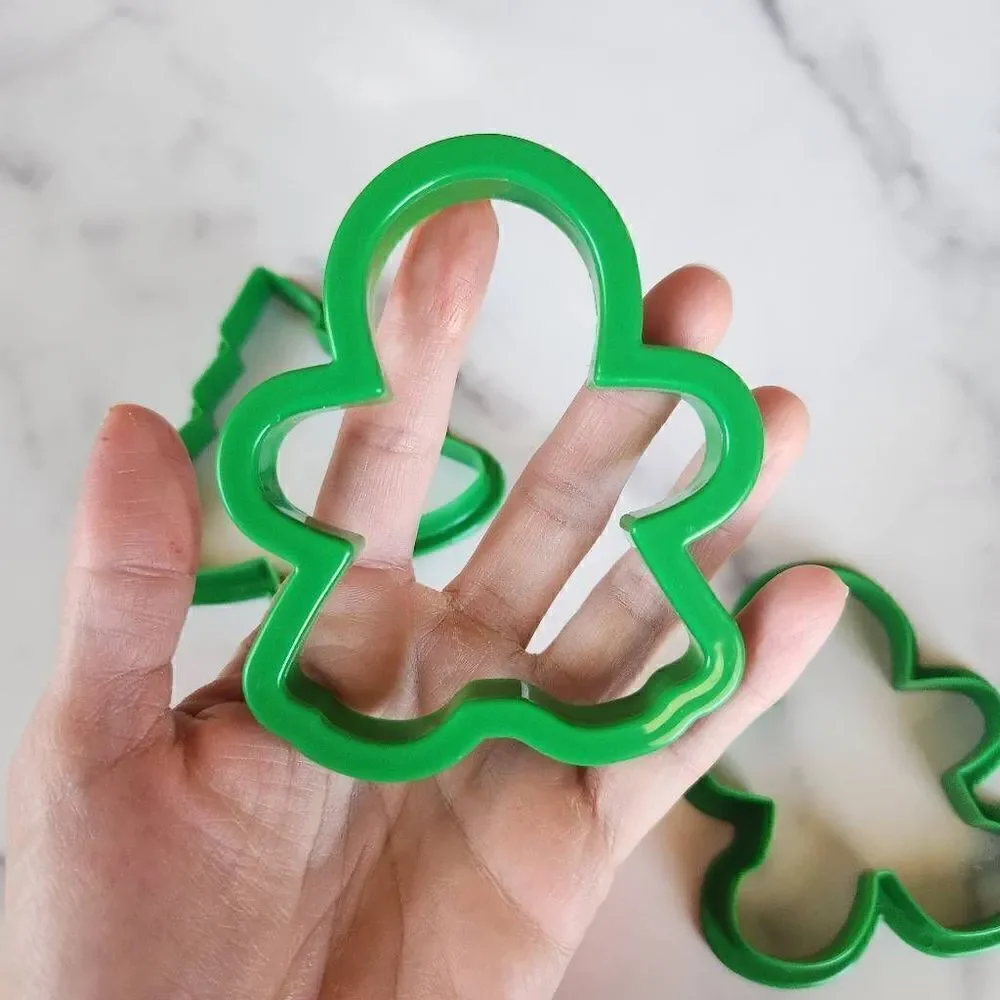 Set of four plastic cookie cutters gingerbread man pine tree heart 4x4